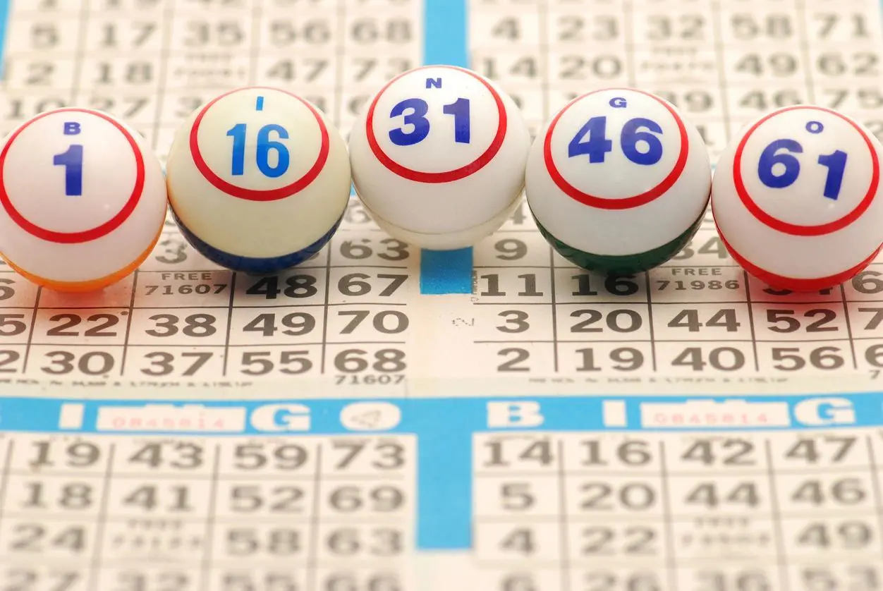 A group of bingo balls on a bingo board.