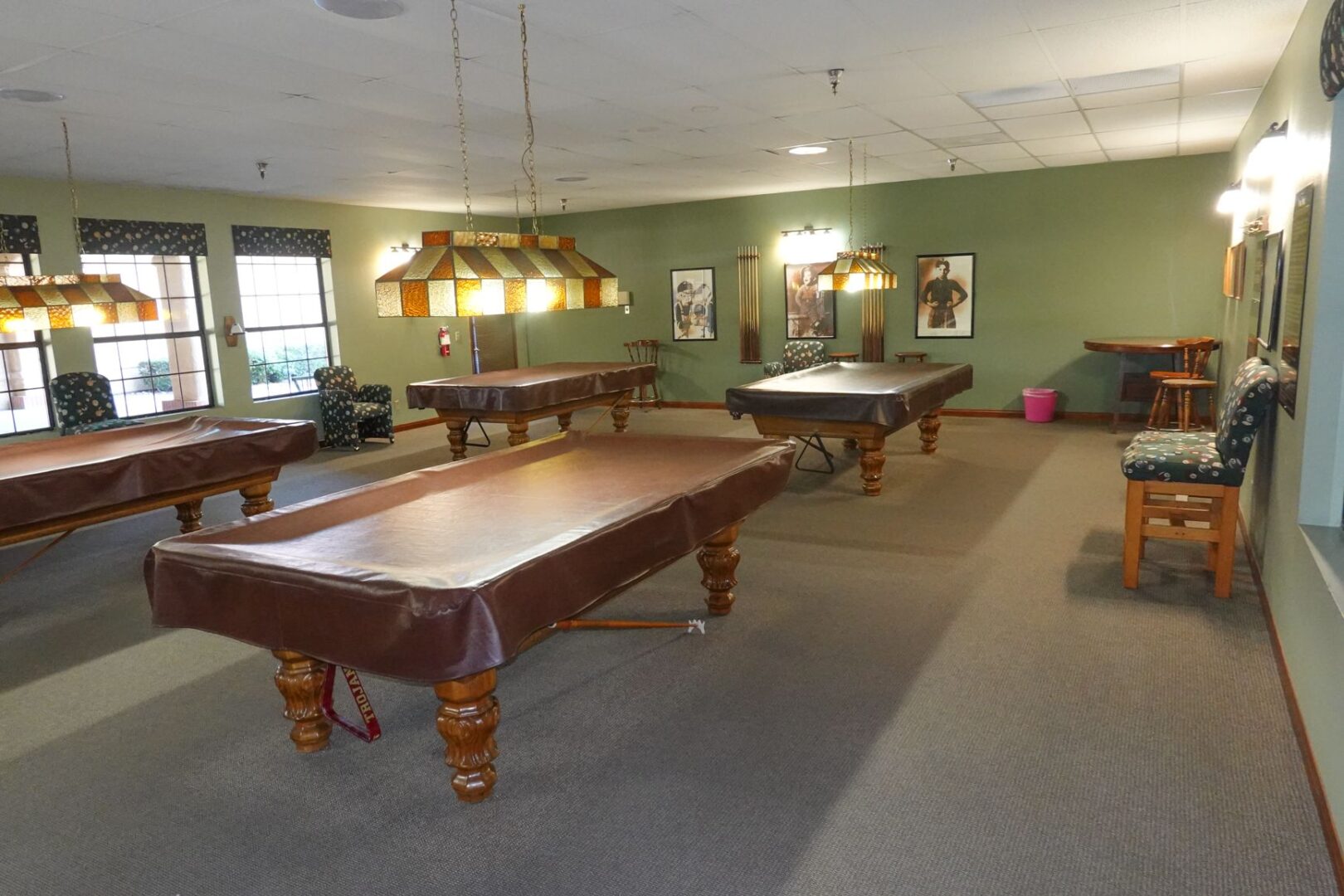 A room with pool tables and billiard tables.