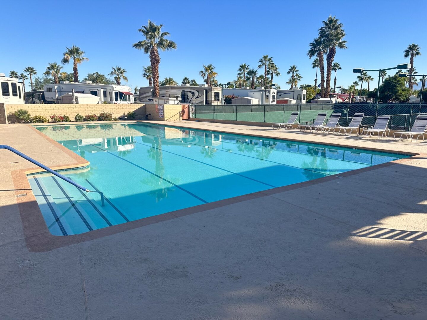 A swimming pool at an rv park in palm springs, california.