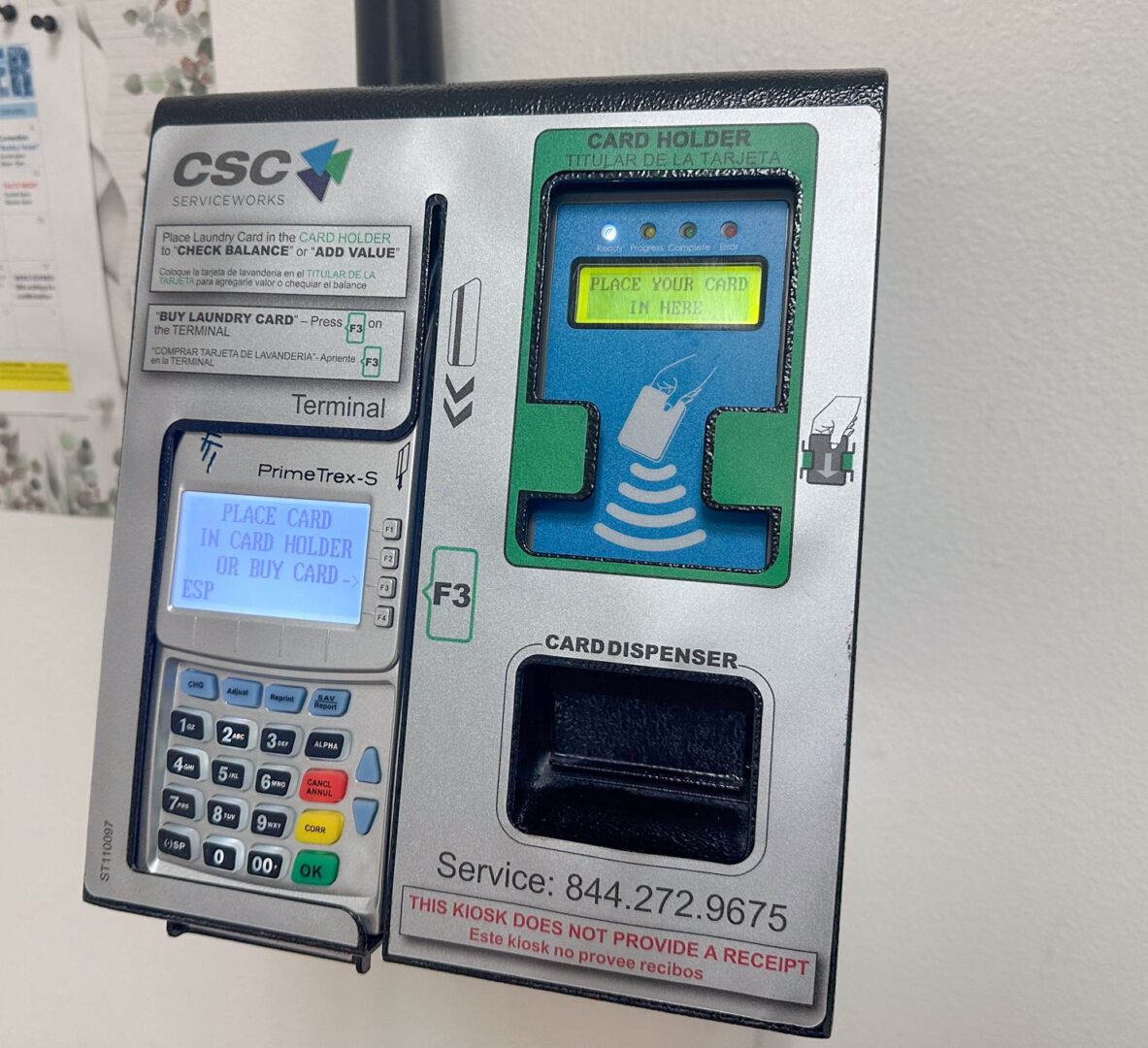 An atm machine with a phone attached to it.