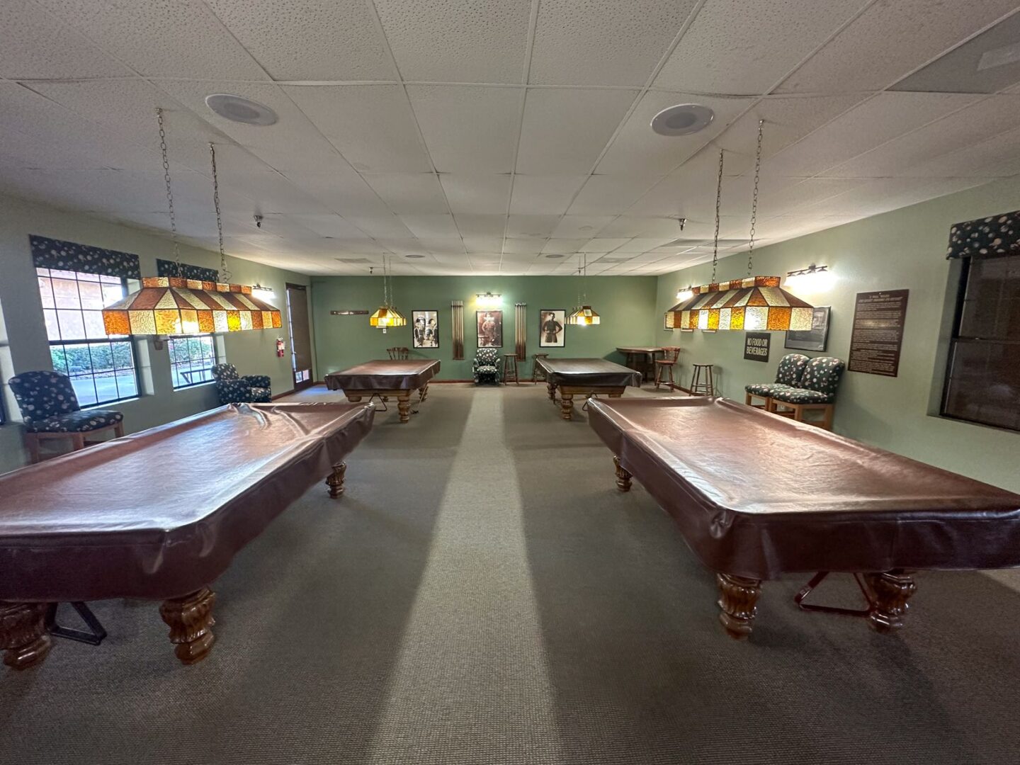 Pool tables in a large room.