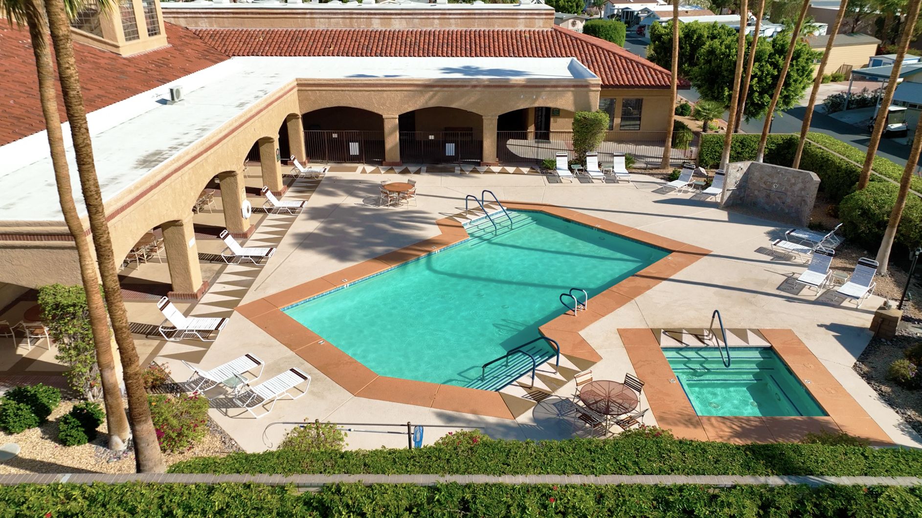 An aerial view of a pool at a hotel.