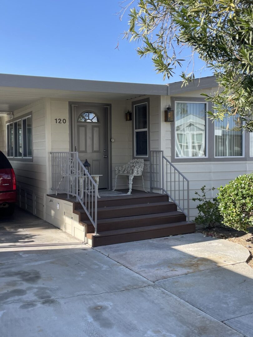 a house with a chair and table near the door