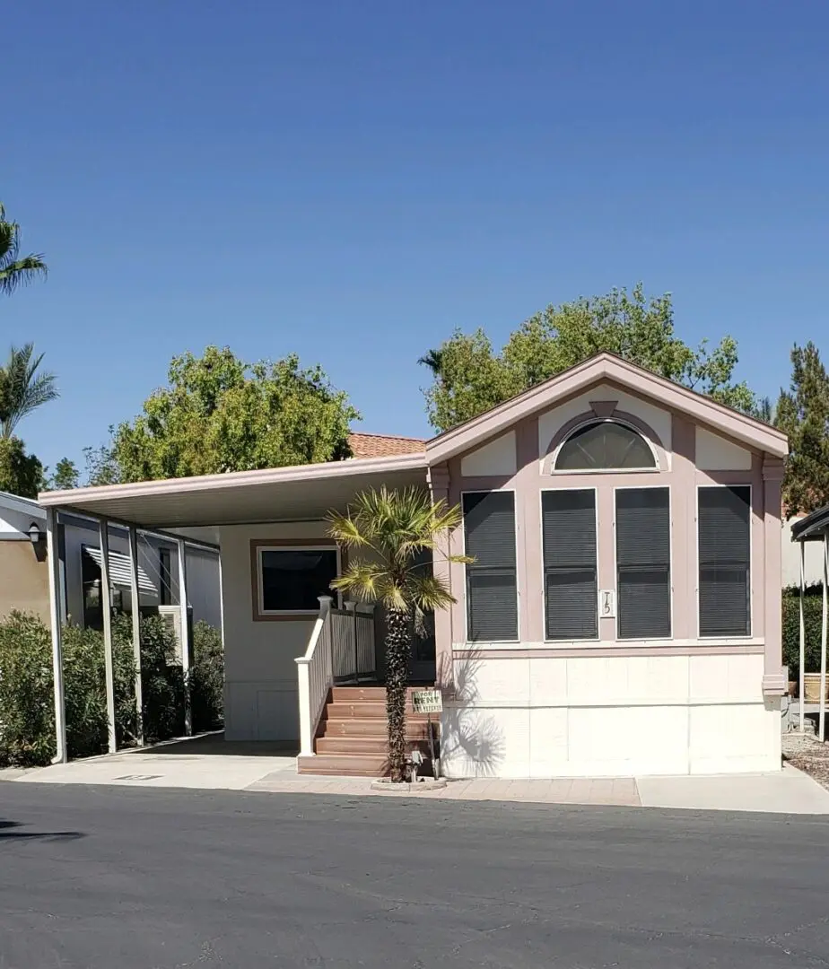 front view of a house with a tree