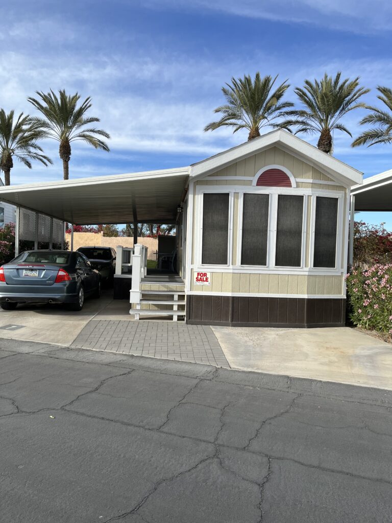 two cars parked under a shelter